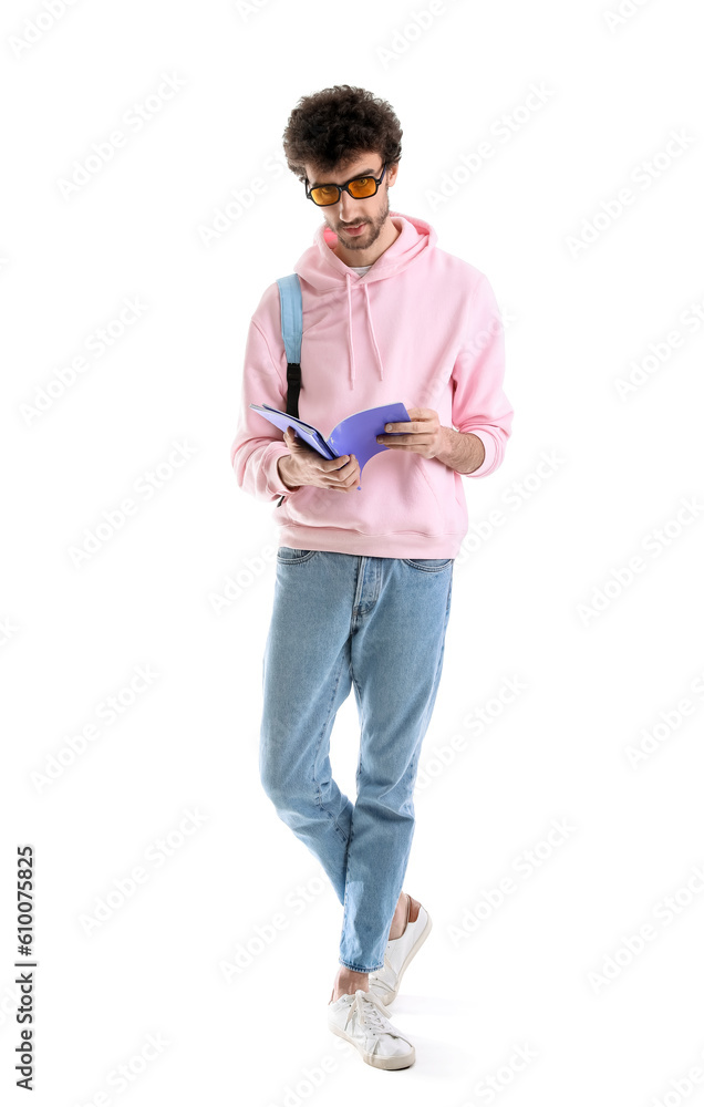 Male student with copybooks on white background