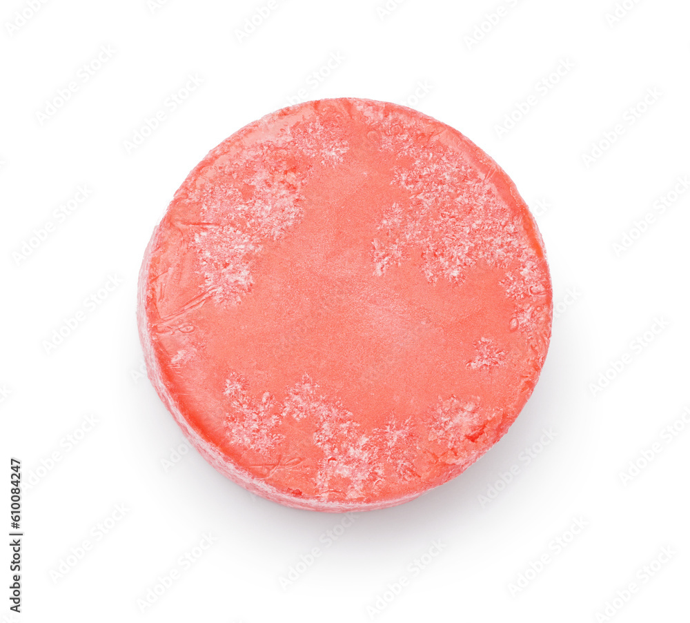 Red solid shampoo bar on white background