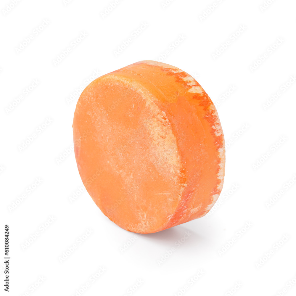 Orange solid shampoo bar on white background