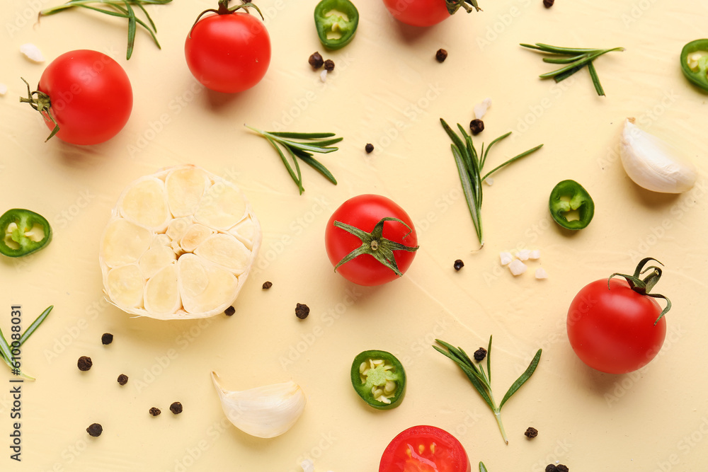 Composition with ripe cherry tomatoes, jalapeno and spices on beige background