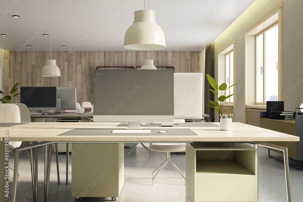 Closeup of modern empty office interior with concrete floor, wooden wall and desks with computers, w