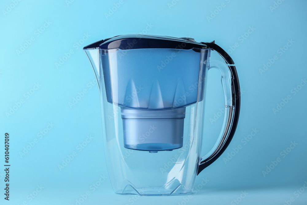 Water filter jug on blue background