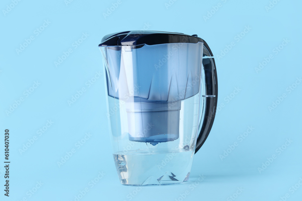 Water filter jug on blue background