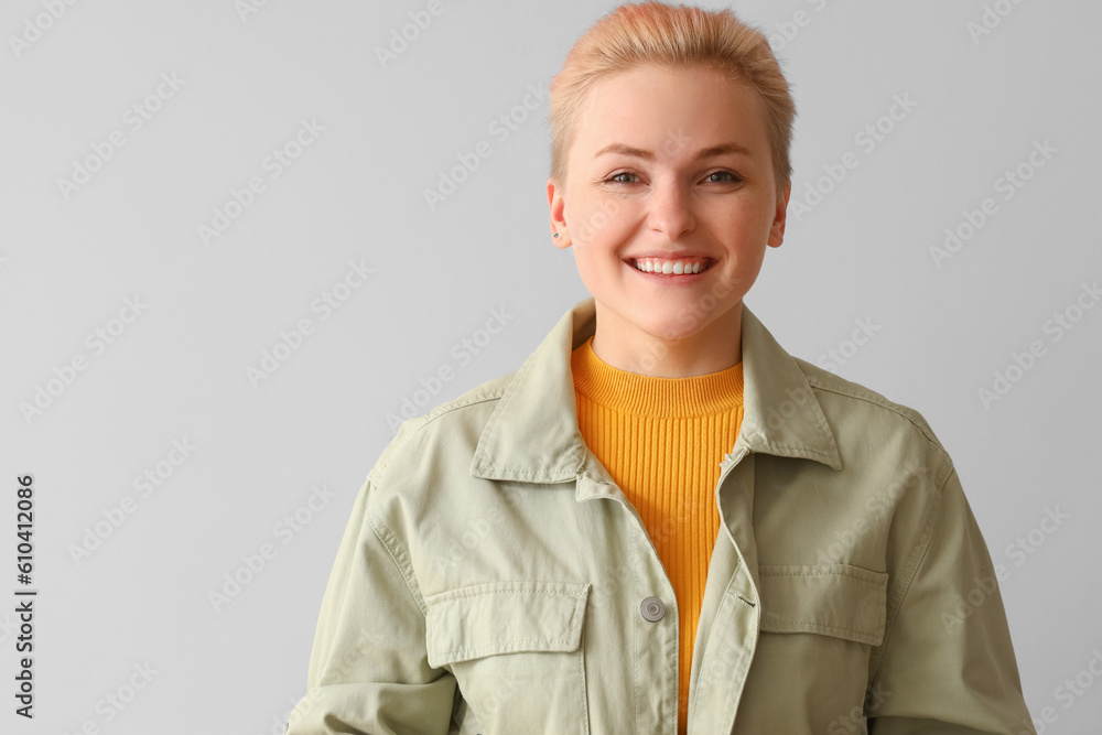 Young woman on light background, closeup