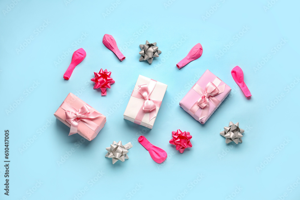 Composition with birthday gift boxes and balloons on pale blue background