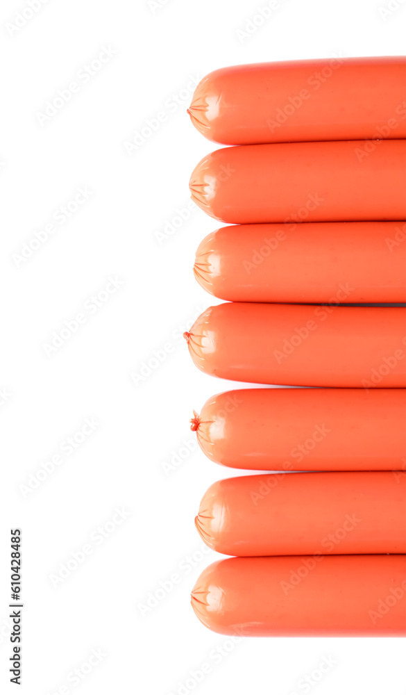 Tasty thin sausages on white background