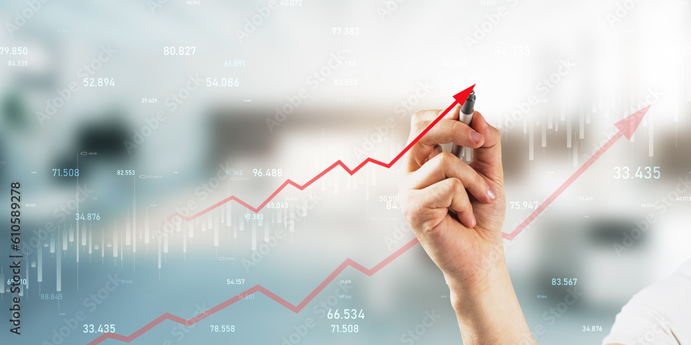 Online trading and investing concept with businessman hand with pen working with financial forex cha