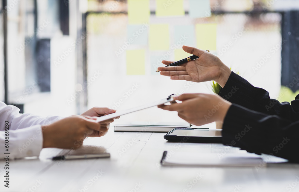 Employer in suit reading resume of job interview candidate profile collection. Woman explaining her 