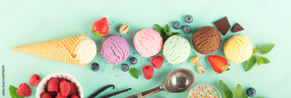 Flying ice cream balls and ingredients on pastel light blue background