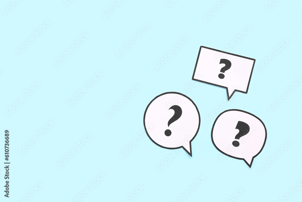 Speech bubbles with question marks on blue background