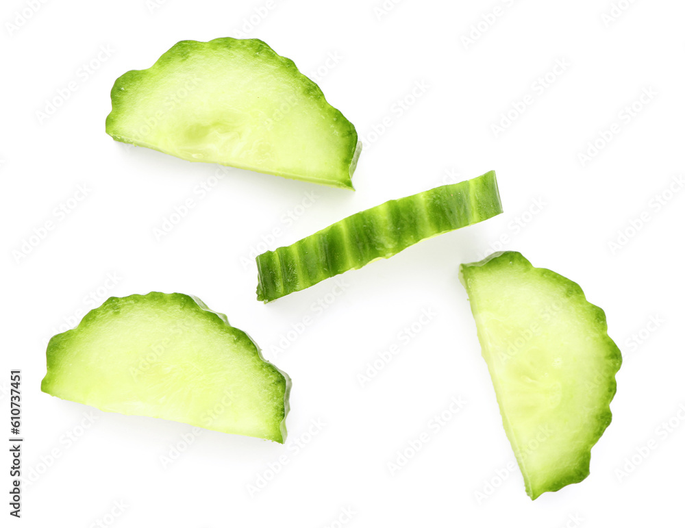 Pieces of fresh cut cucumber isolated on white background