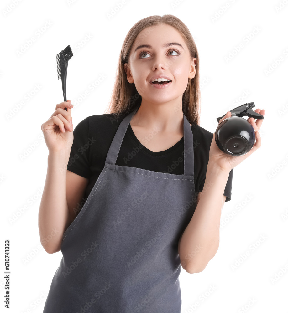 Female hairdresser with spray and brush on white background