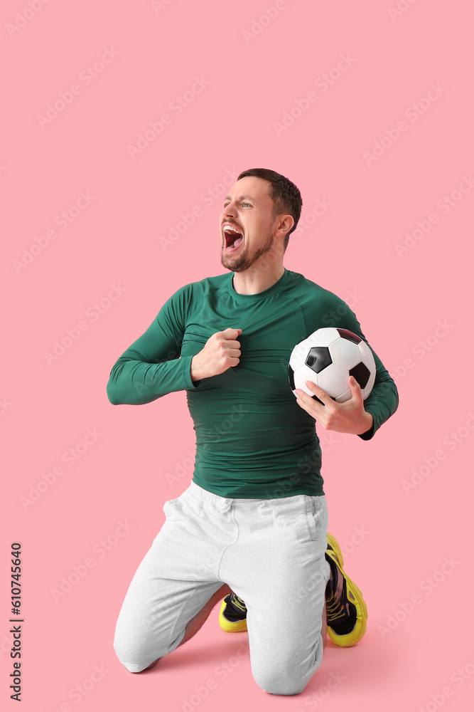 Screaming man with soccer ball on pink background