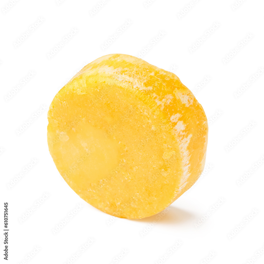 Yellow solid shampoo bar on white background