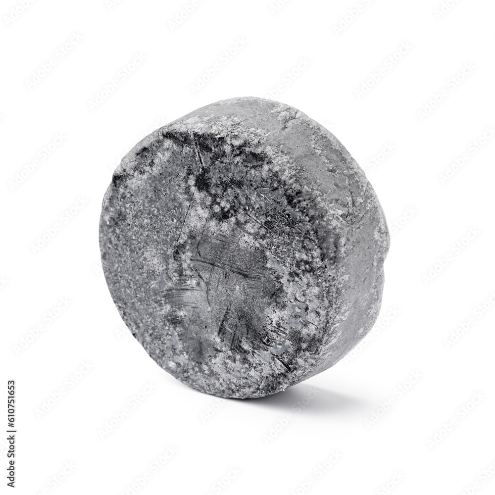 Grey solid shampoo bar on white background