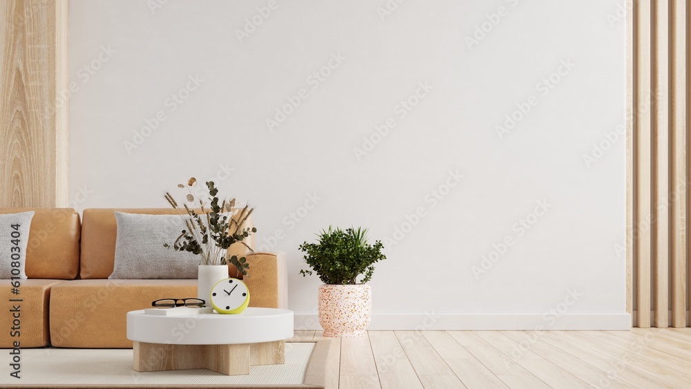 Living room wall mockup with leather sofa and decor on white background.3d rendering