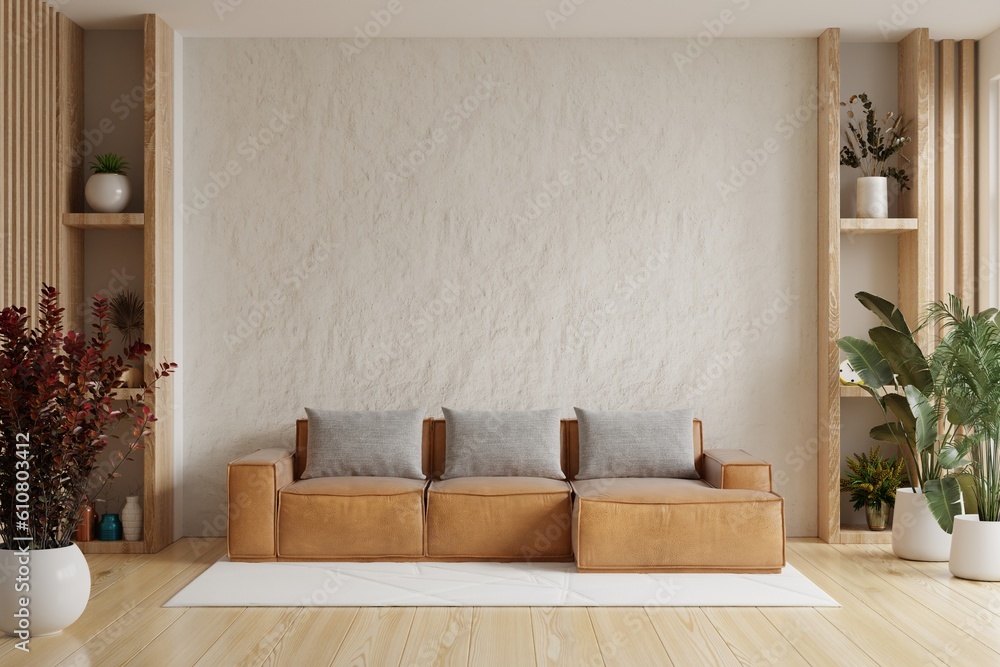 Living room wall mockup with leather sofa and decor on white plaster wall background.3d rendering