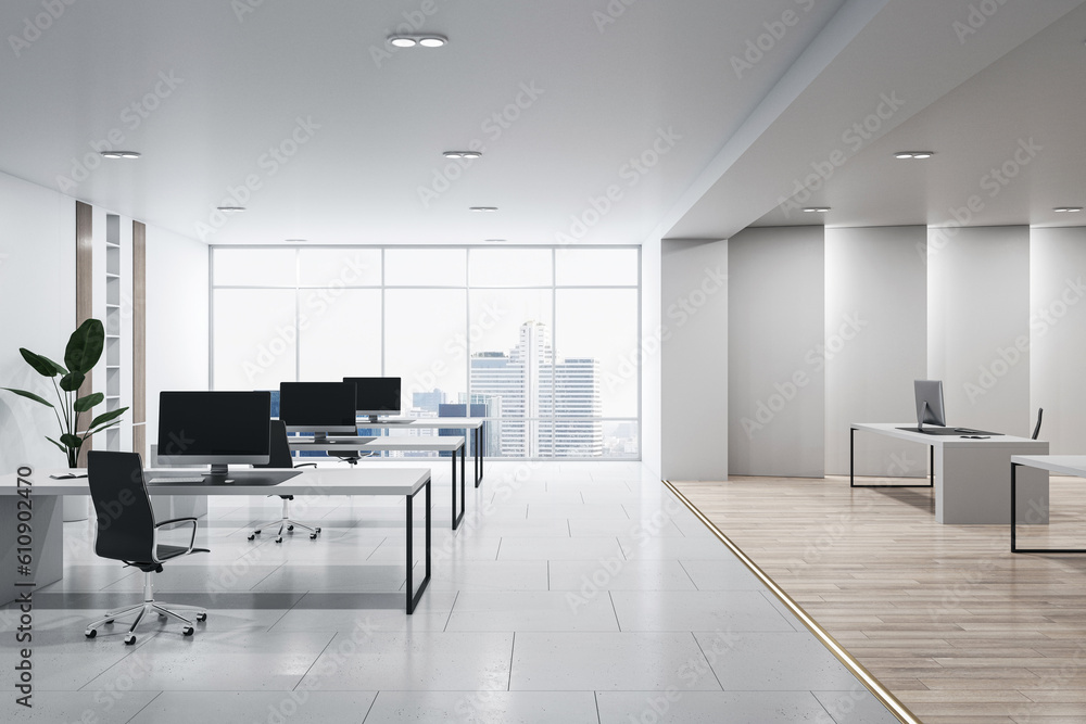 Front view of modern empty office interior with concrete and wooden floor, white walls and desks wit