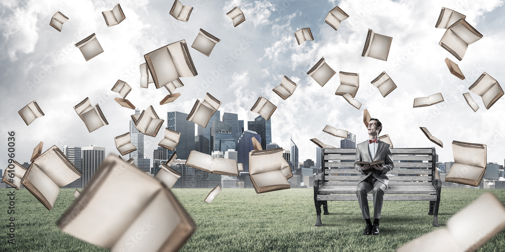 Young businessman or student studying the science in summer park