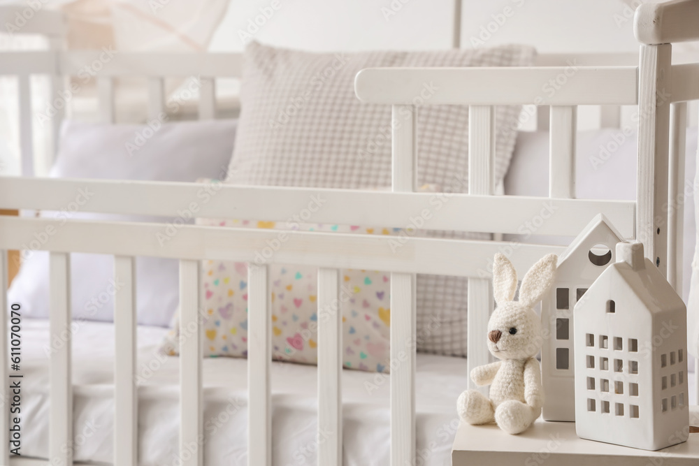 Toy with candle holders on stool in childrens bedroom, closeup