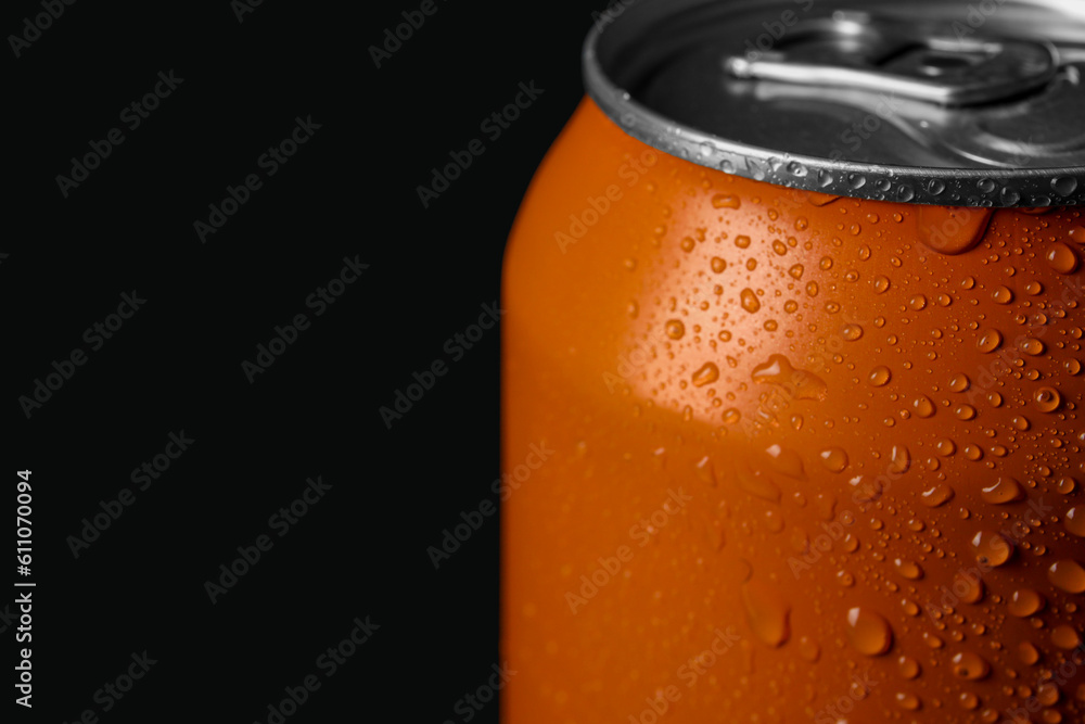 Can of fresh soda with water drops on dark background, closeup