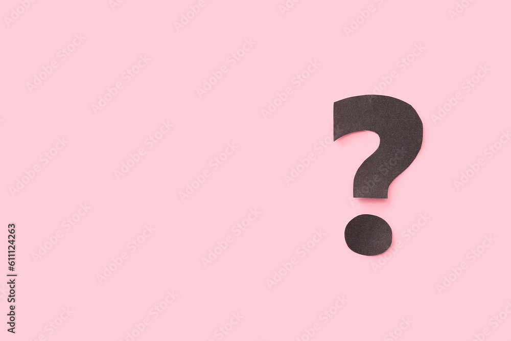 Paper question mark on pink background