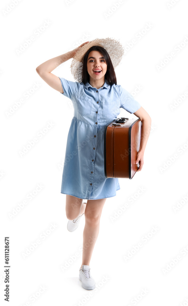 Young woman with brown suitcase running on white background