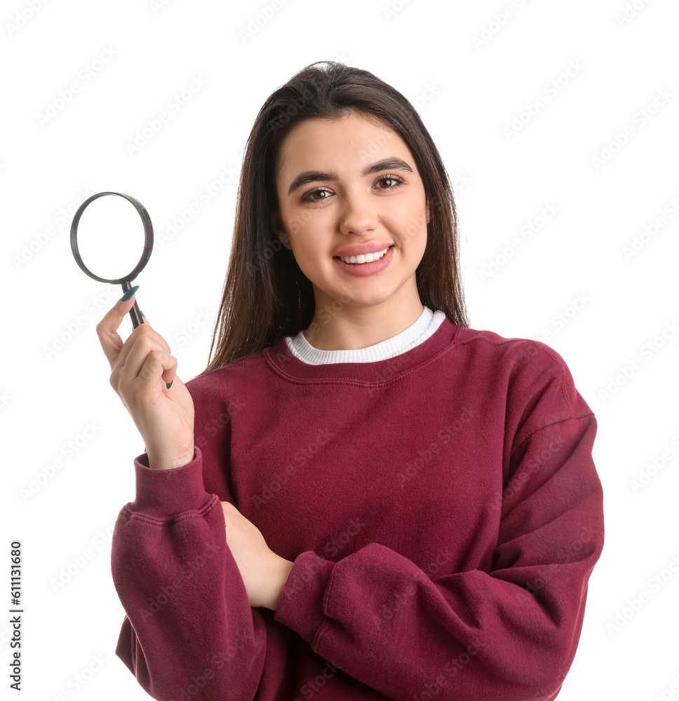 Young woman with magnifier on white background