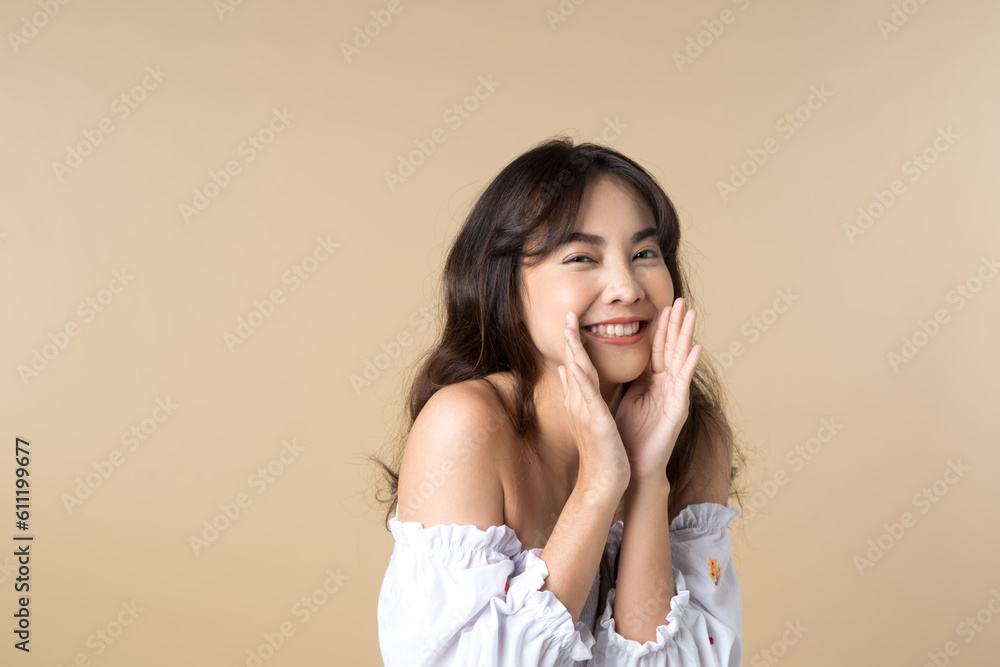 Young Asian woman doing a shocked surprise gesture shouting with hands cupped around mouth isolated 