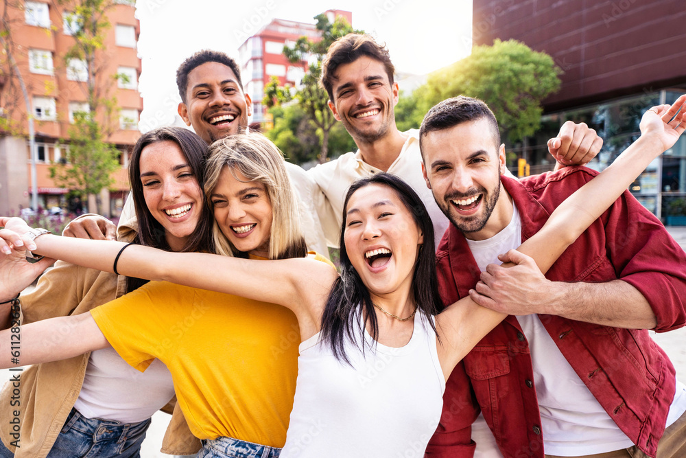 Multiracial best friends having fun outside - Group of young people smiling at camera outdoors - Fri