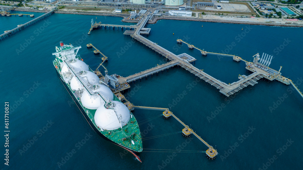 LNG (Liquified Natural Gas) tanker anchored in Gas terminal gas tanks for storage. Oil Crude Gas Tan