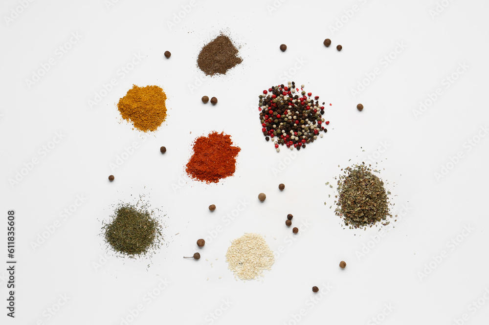 Heaps of fresh aromatic spices on light background