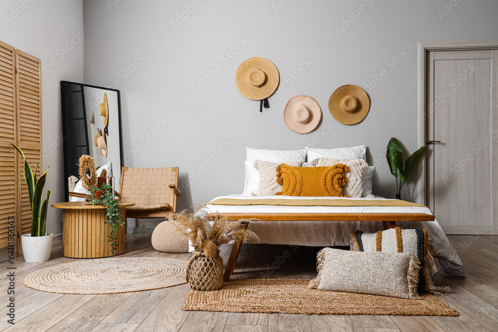 Interior of bedroom with coffee table and armchair