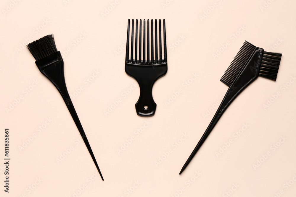 Hairdressers brushes on beige background