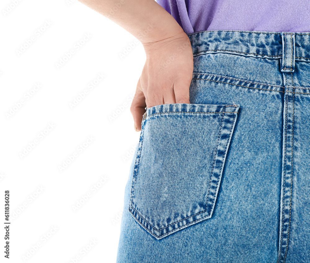 Young woman in stylish jeans on white background, back view