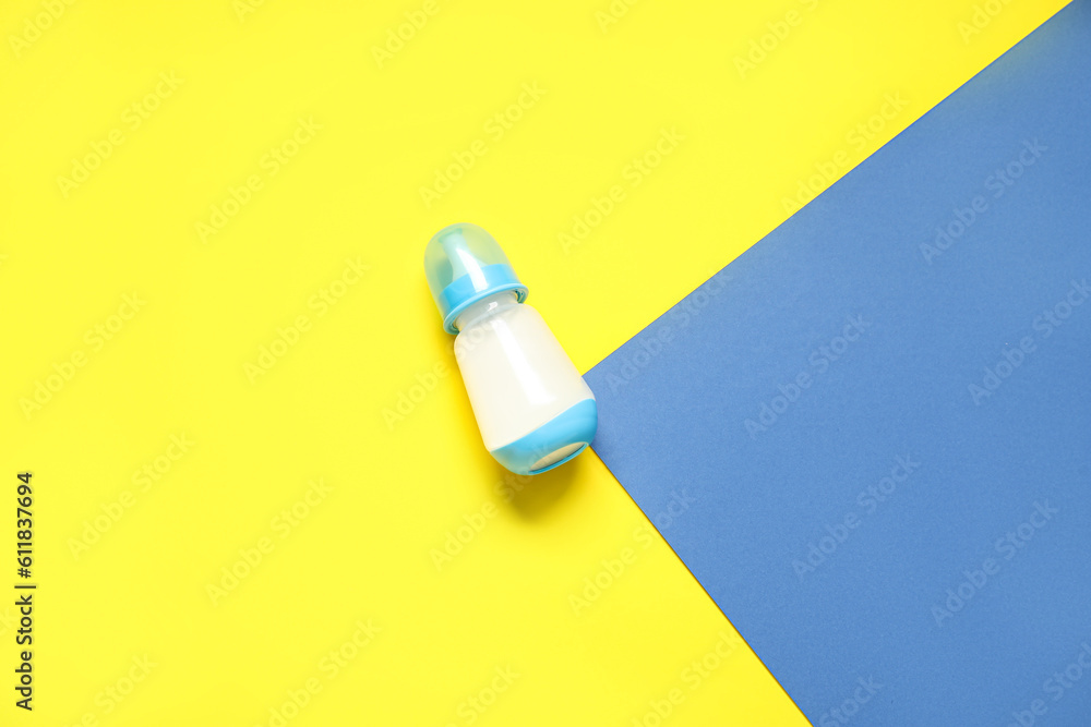 Bottle with milk for baby on color background