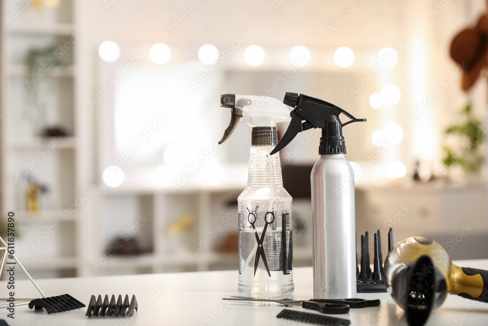 Different hairdressing tools on table in beauty salon