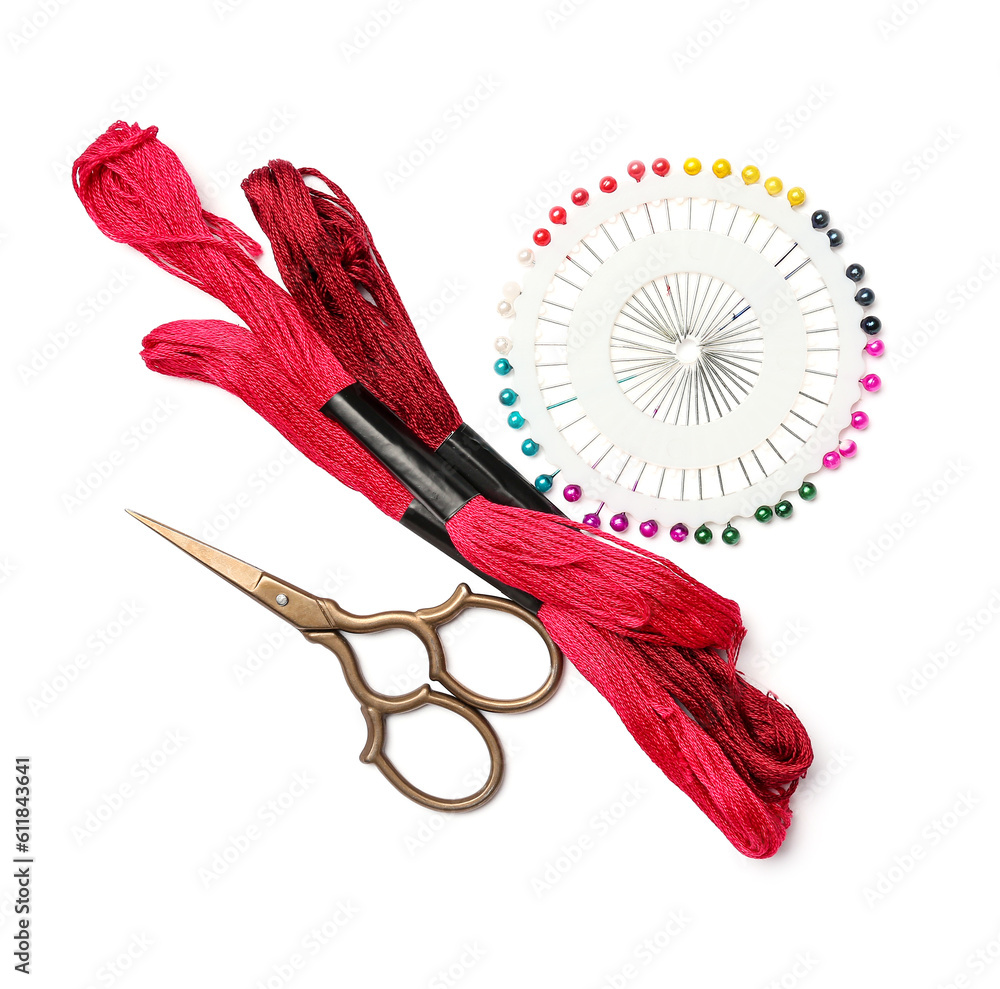 Mouline threads with scissors and ball pins isolated on white background