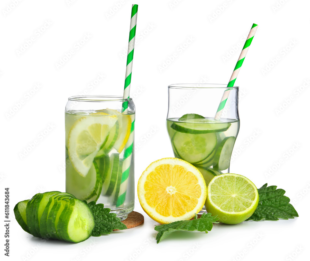 Glasses of infused water with cucumber slices on white background