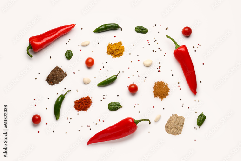 Composition with fresh aromatic spices and vegetables on light background