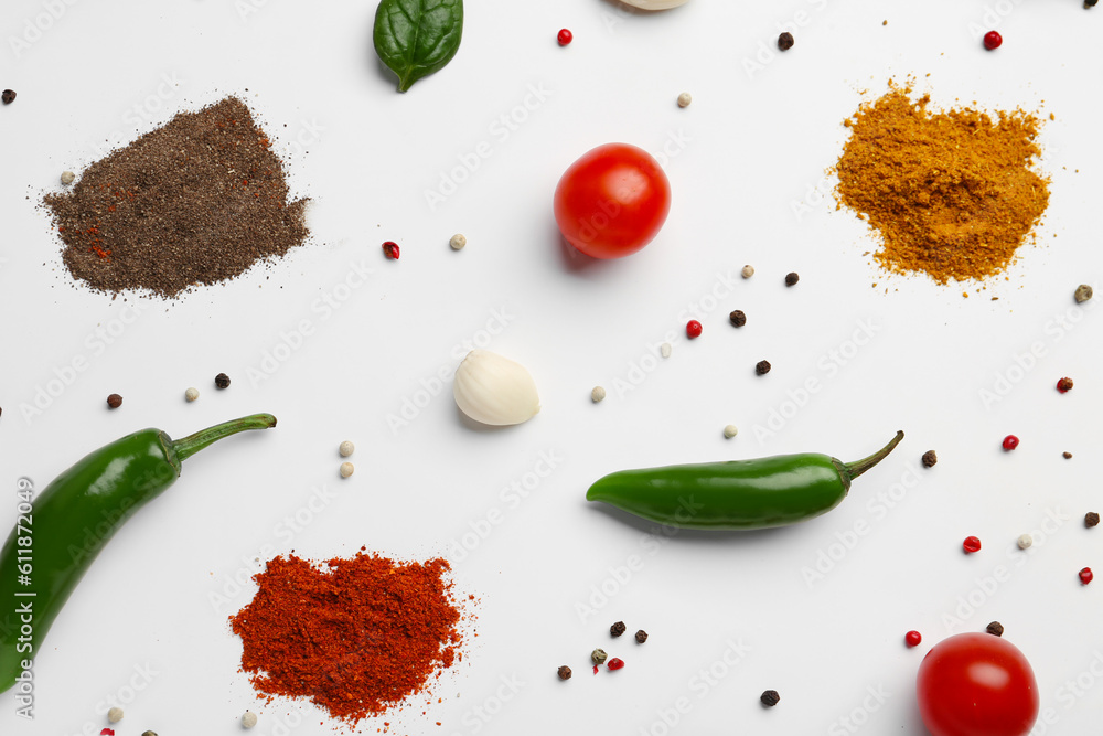 Composition with fresh aromatic spices and vegetables on light background