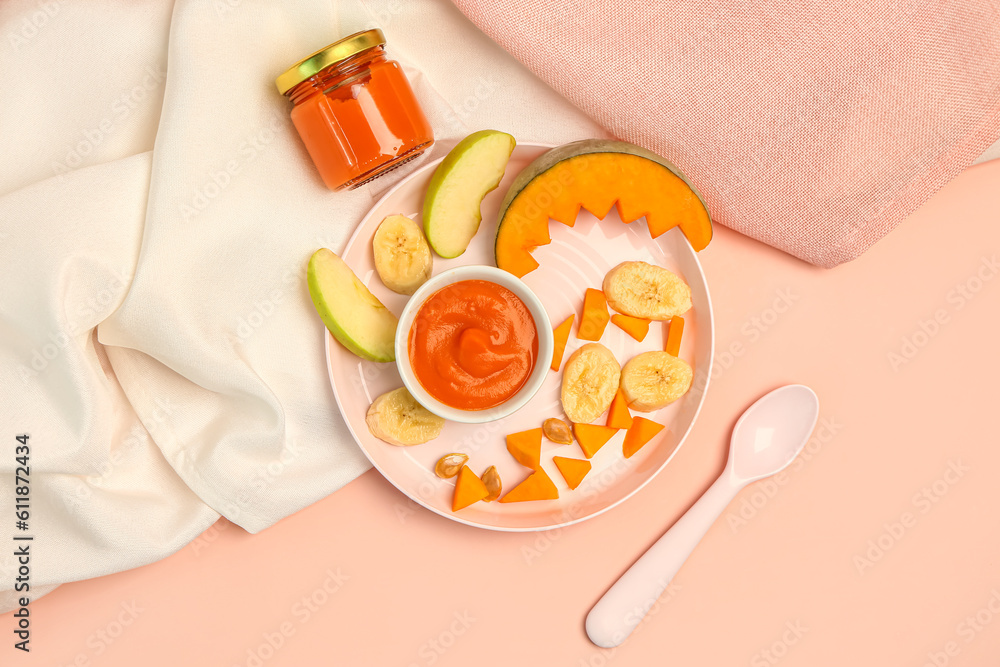 Plate with healthy baby food, fruits and pumpkin on color background