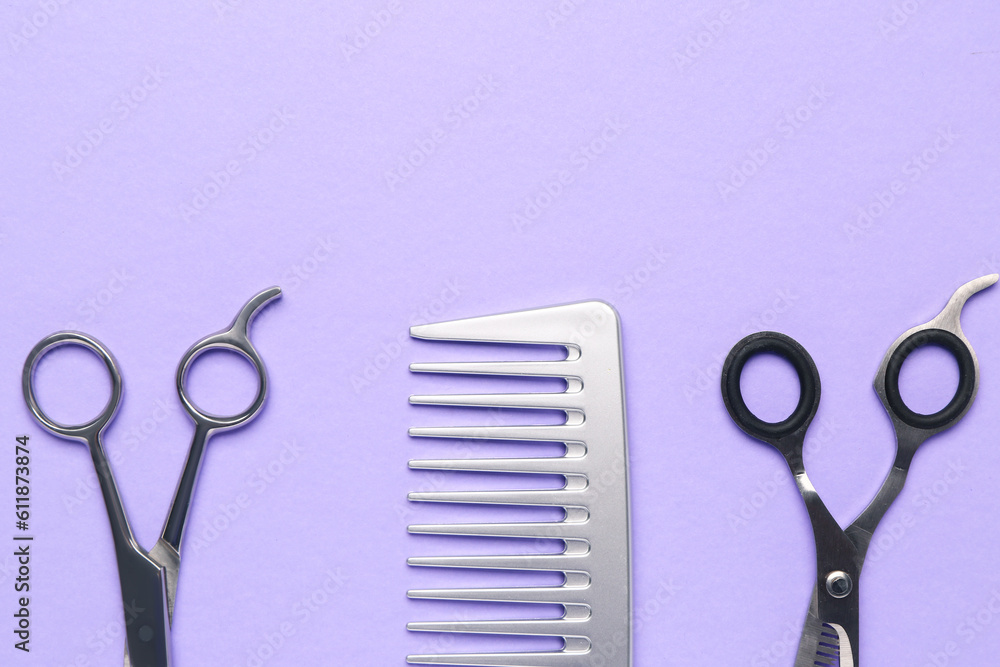 Hair comb with scissors on violet background