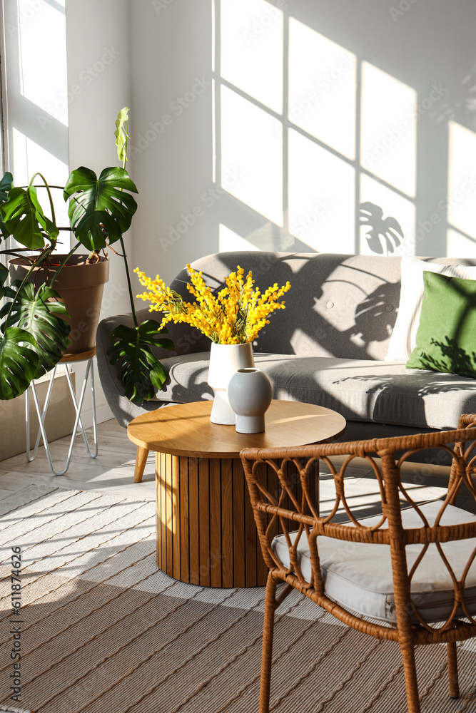 Interior of bright living room with armchairs, sofa and coffee table