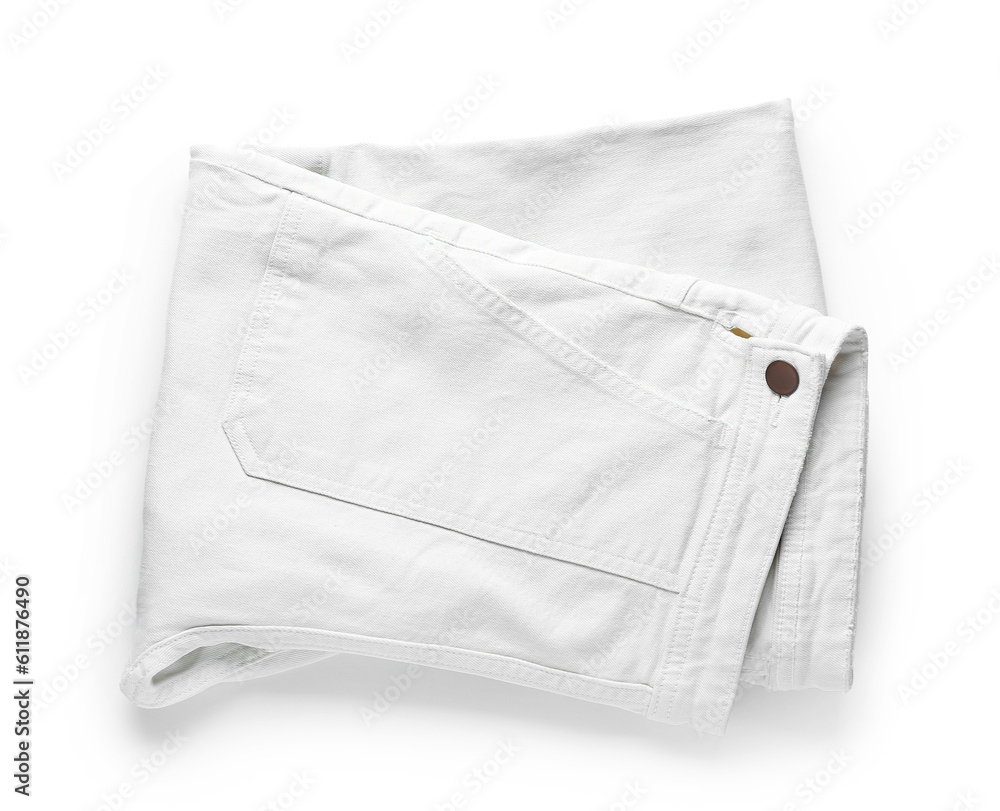 Folded jeans on white background