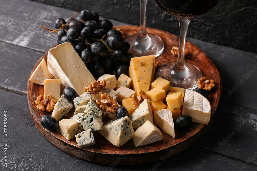 Plate with pieces of tasty cheese on table