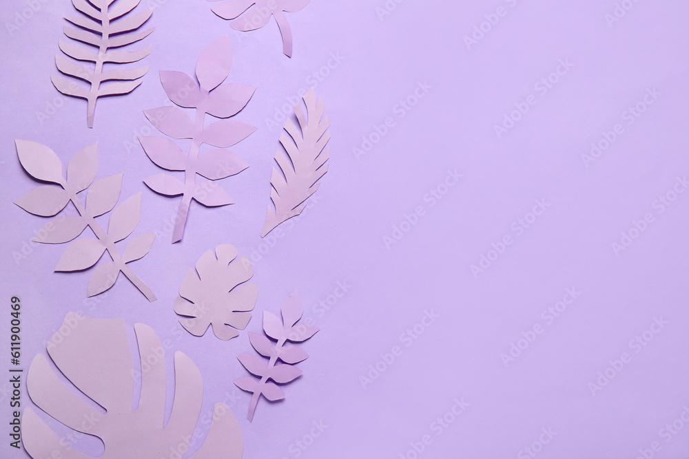 Different paper tropical leaves on lilac background