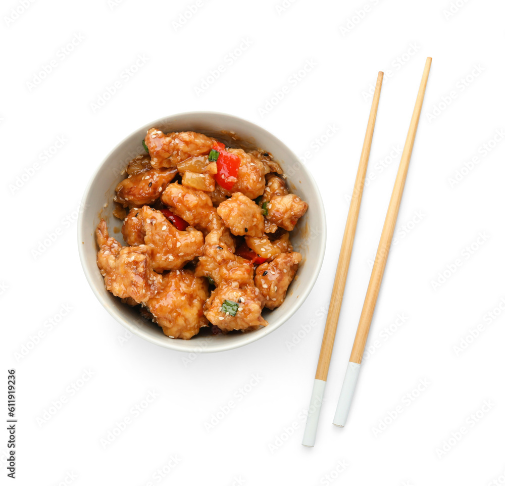 Bowl with tasty sweet and sour chicken on white background