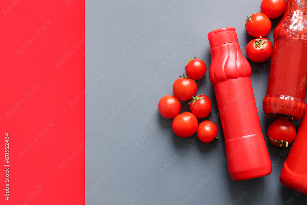 Bottles of ketchup and tomatoes on colorful background