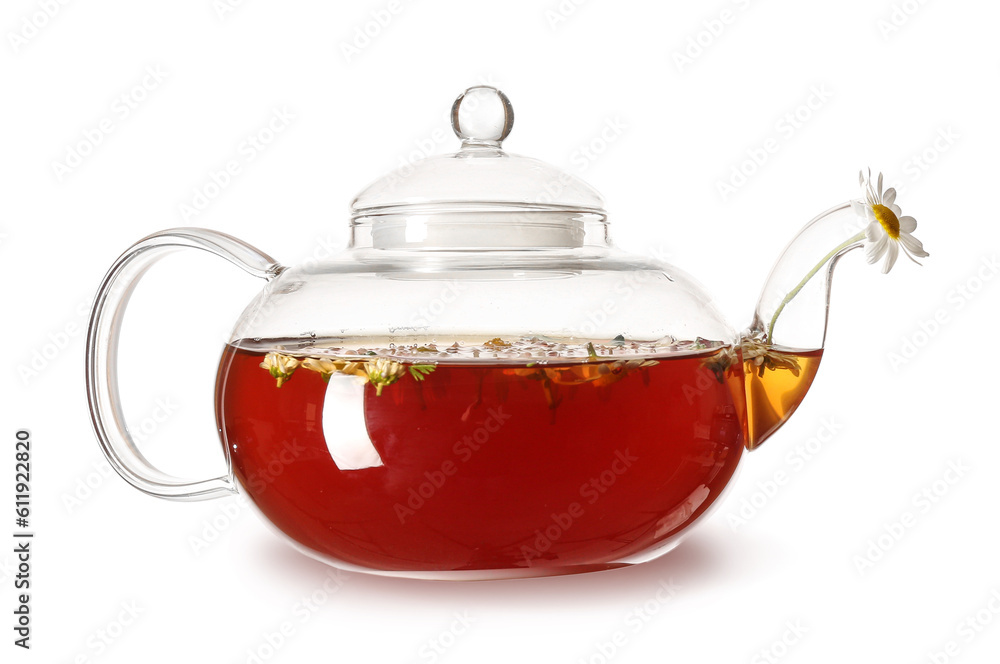 Teapot of natural chamomile tea with flowers isolated on white background